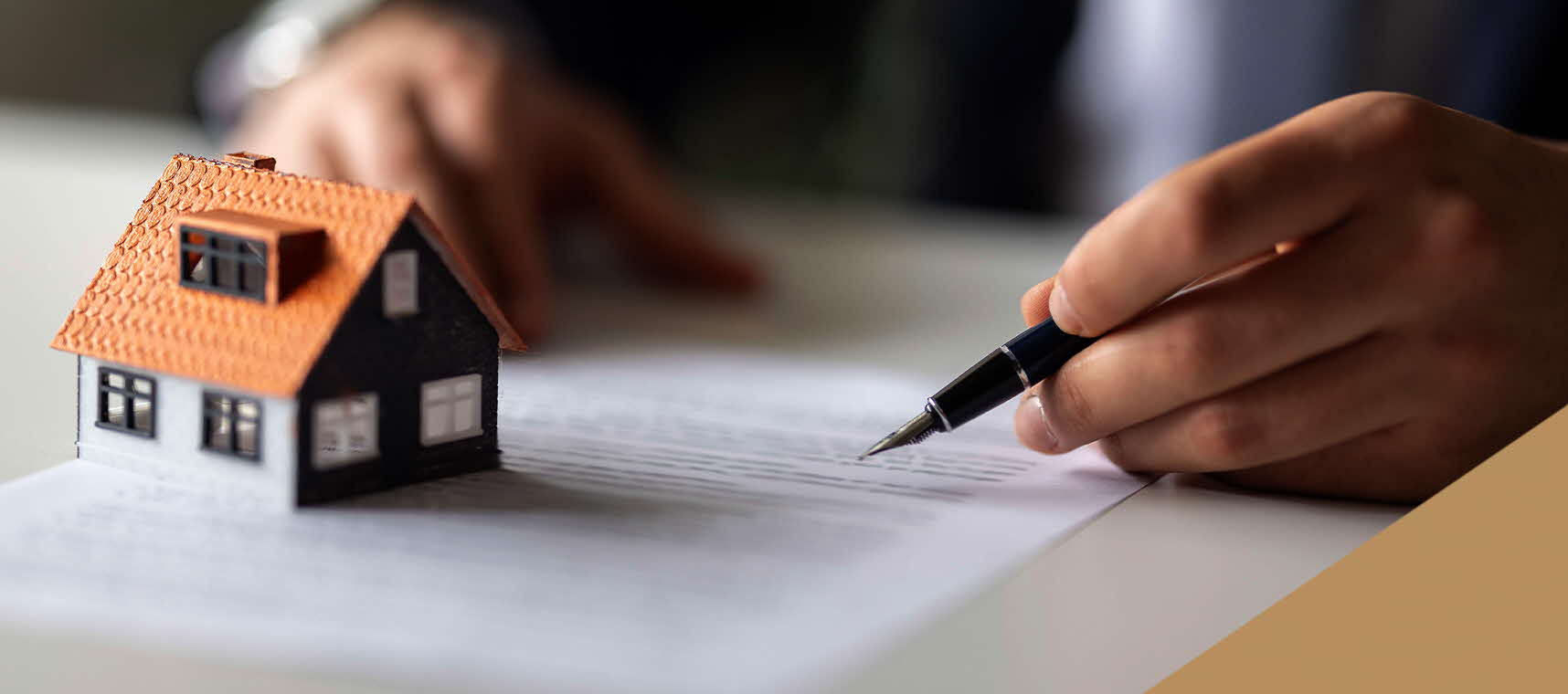 Man preparing to sign off on a property-related contract.