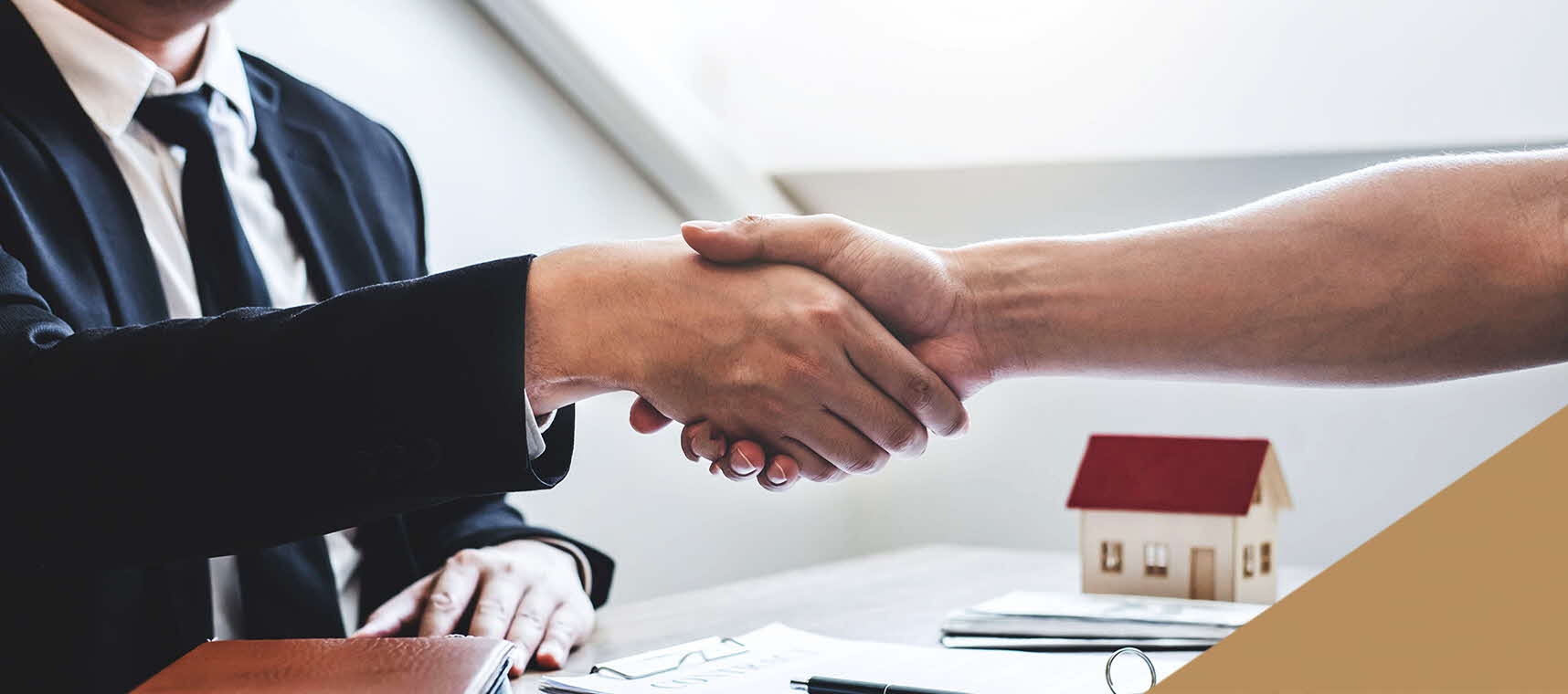 Property professional shaking hands with a new property homeowner.